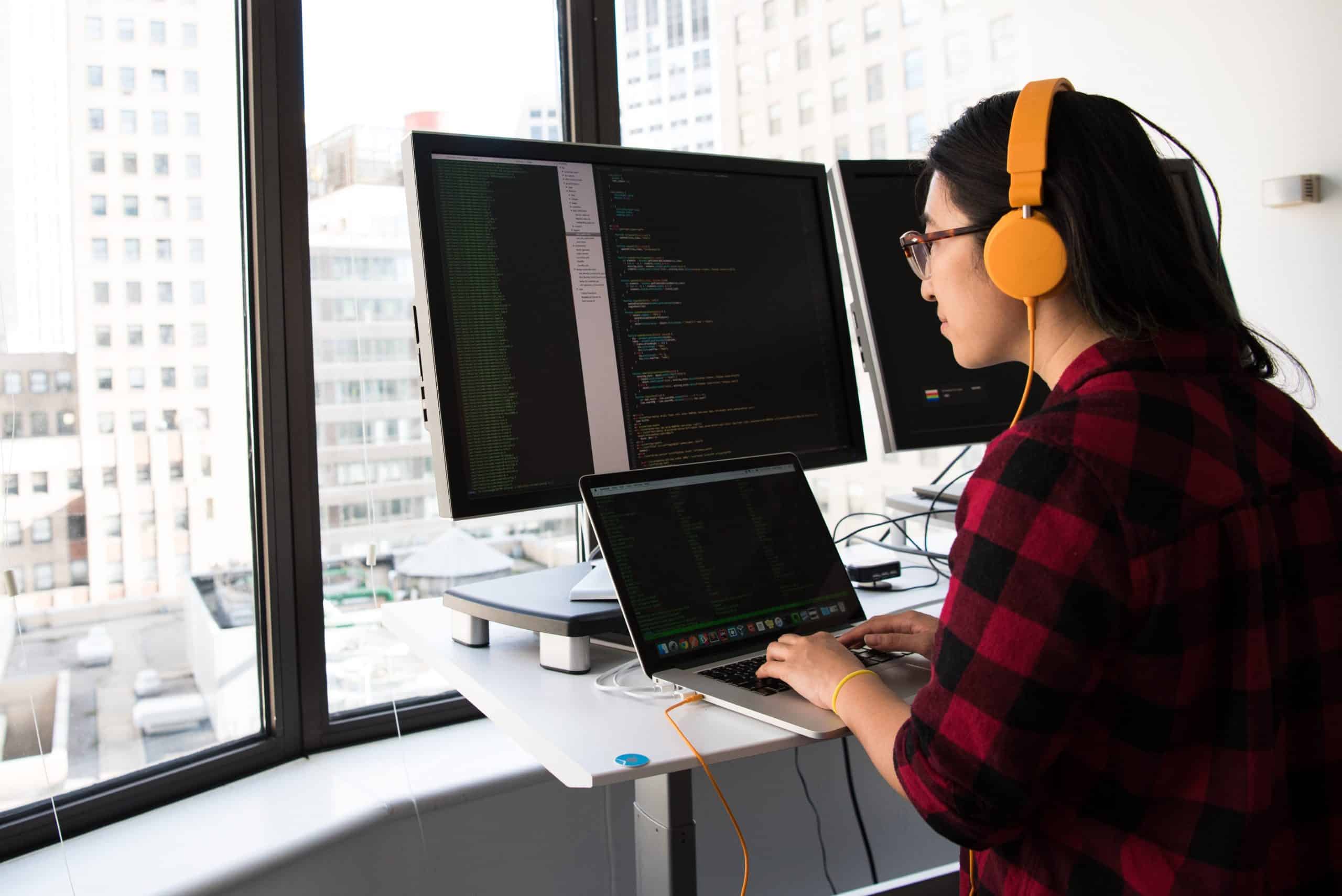female on computer using code and programming language