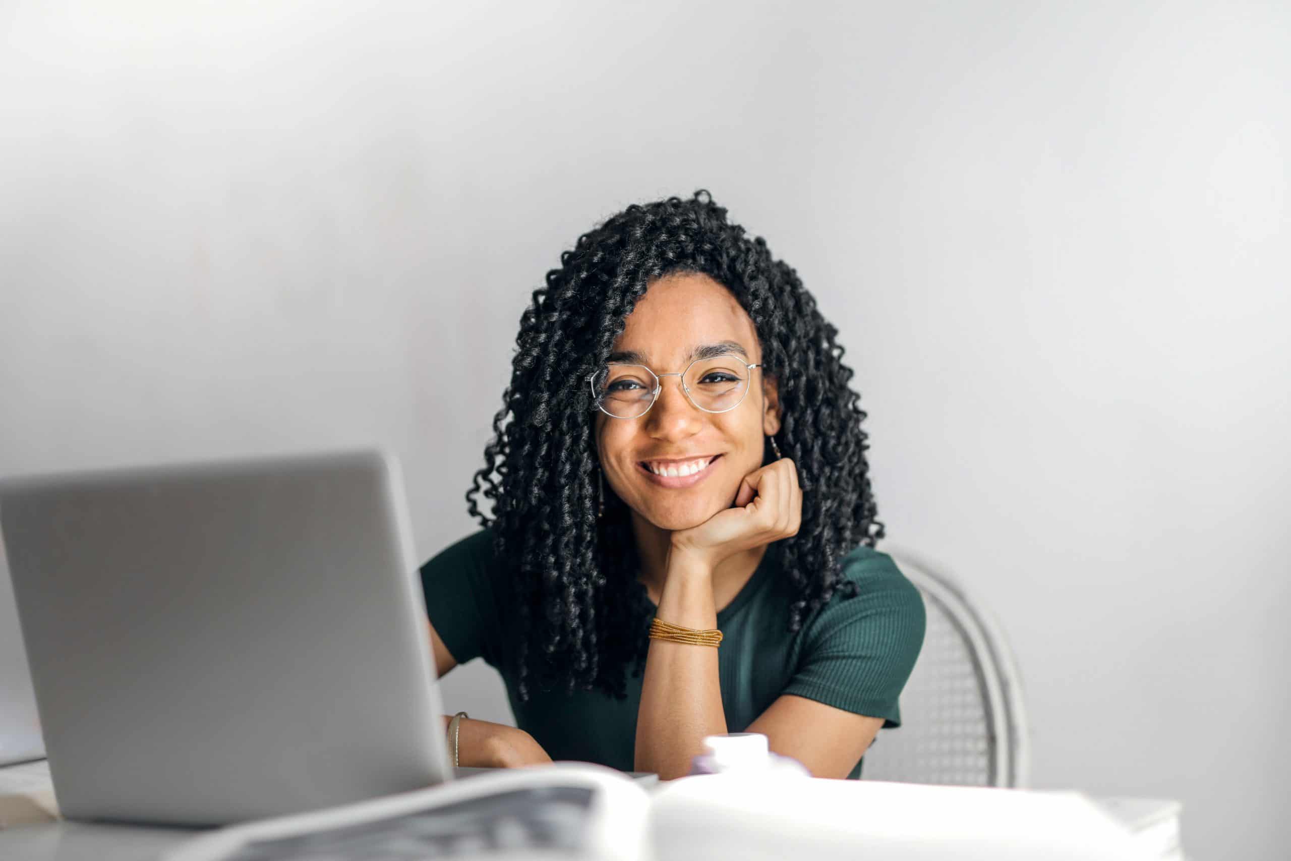 female distance learning tutor with laptop