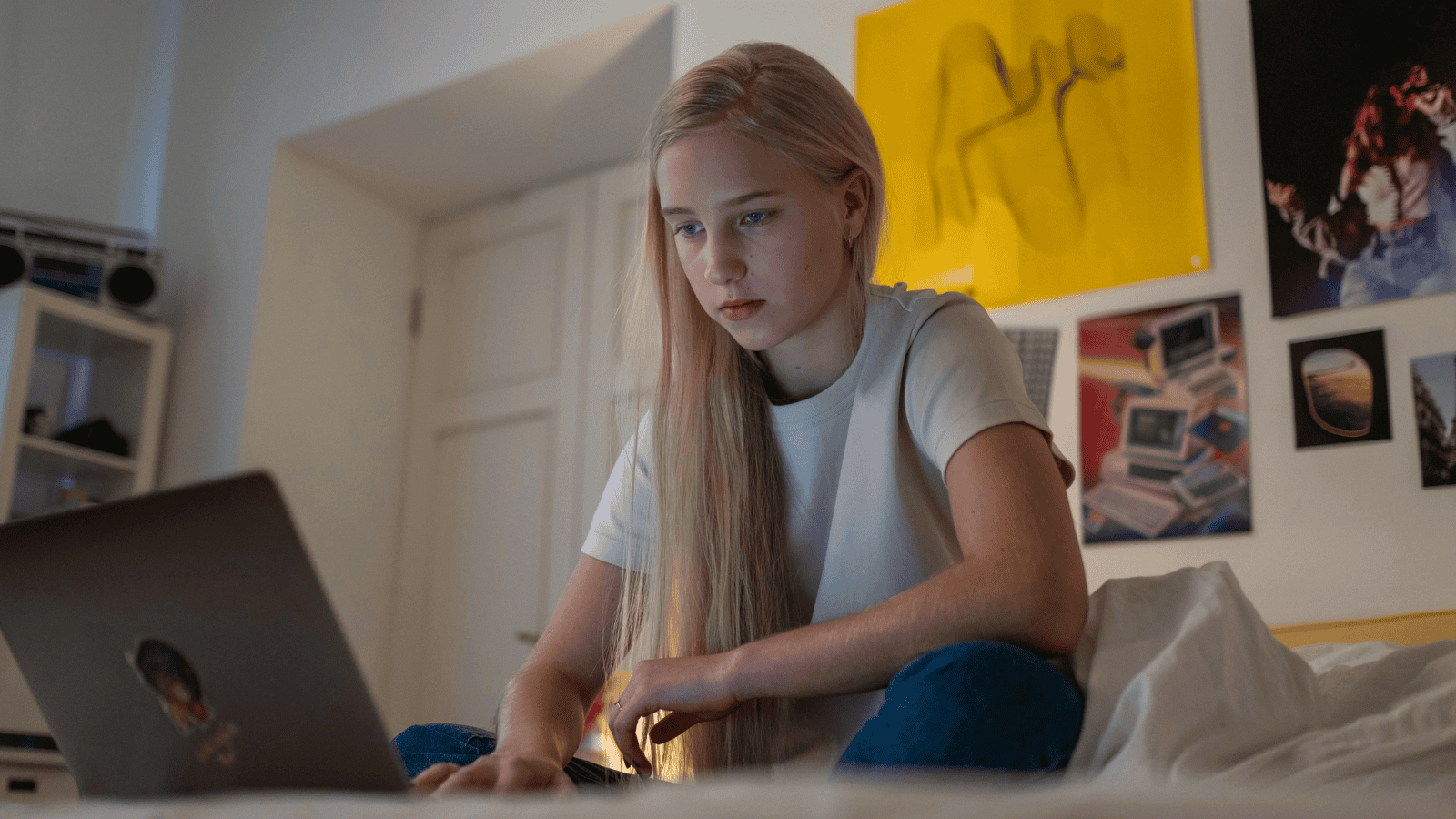 young female on laptop taking gcse resit course