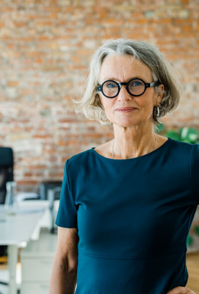 Female tutor smiling into the camera