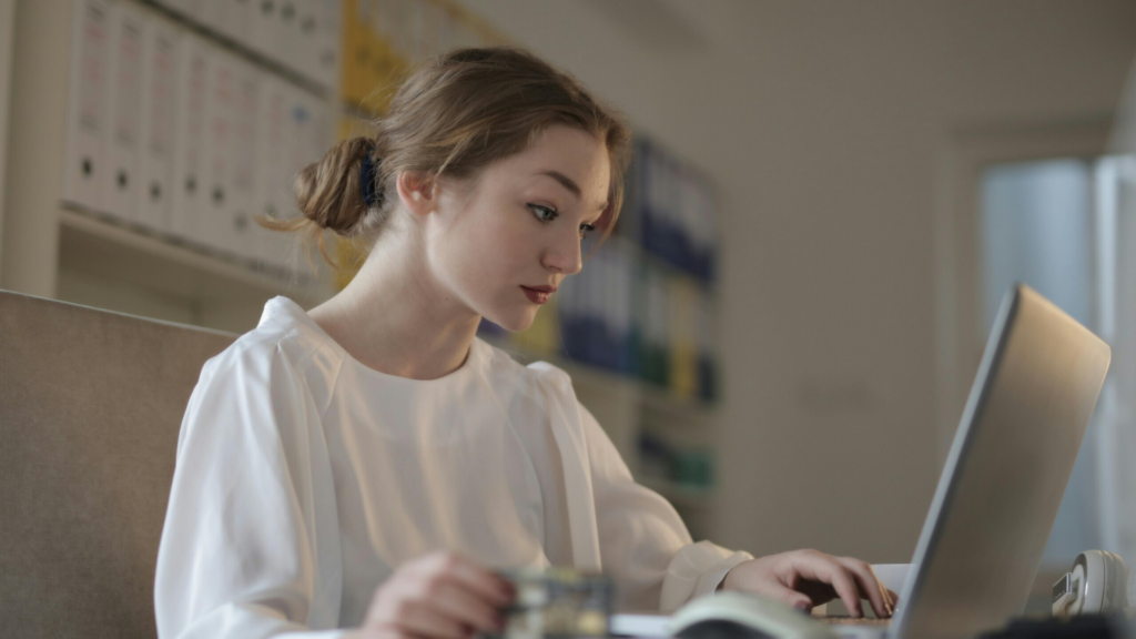 NEC student on laptop