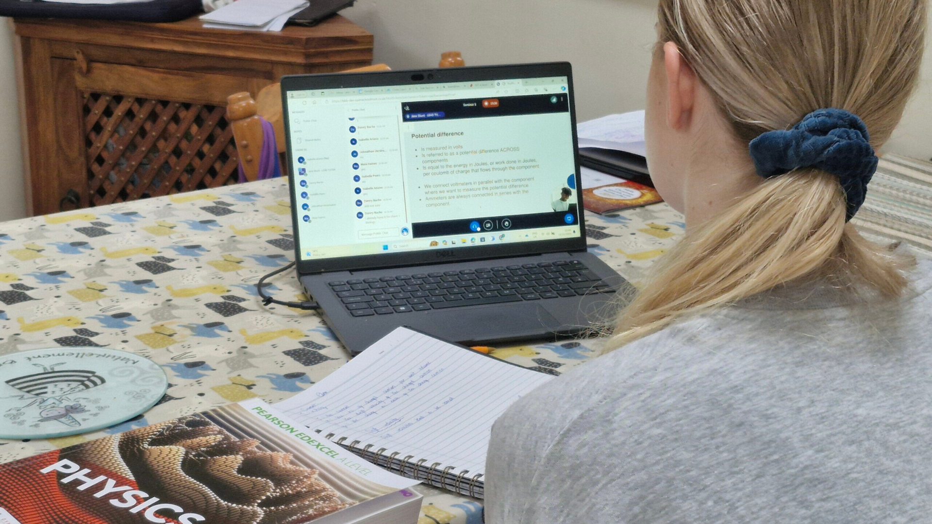 Izzy studing her A level Physics Course