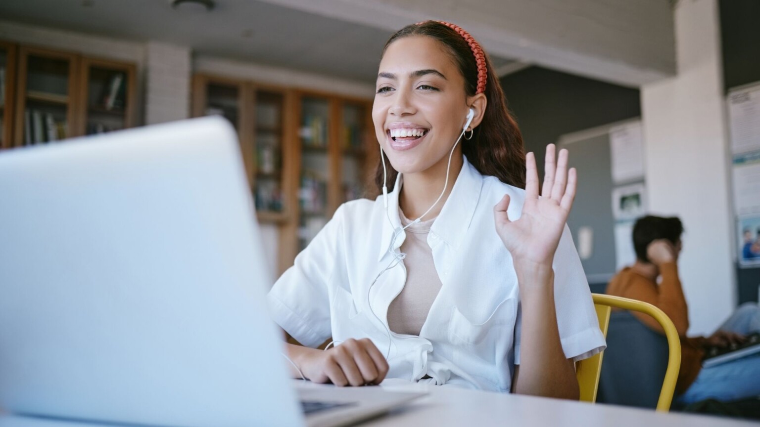 Join us for expert-led events designed to support your learning journey. Girl on a webinar sat at a desk with laptop open.