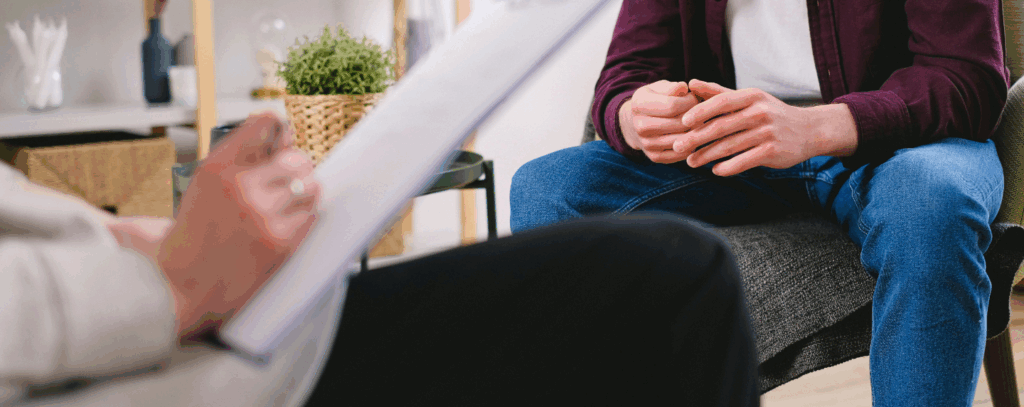 A person sitting in a supportive conversation, illustrating the practical use of counselling skills.