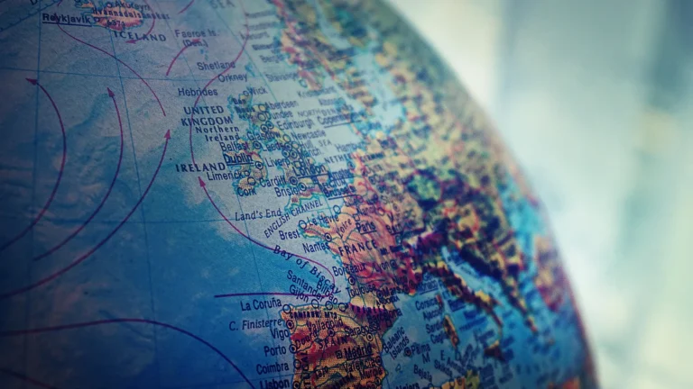 Close-up of a globe focused on the United Kingdom and Western Europe, representing geographical exploration and global awareness.