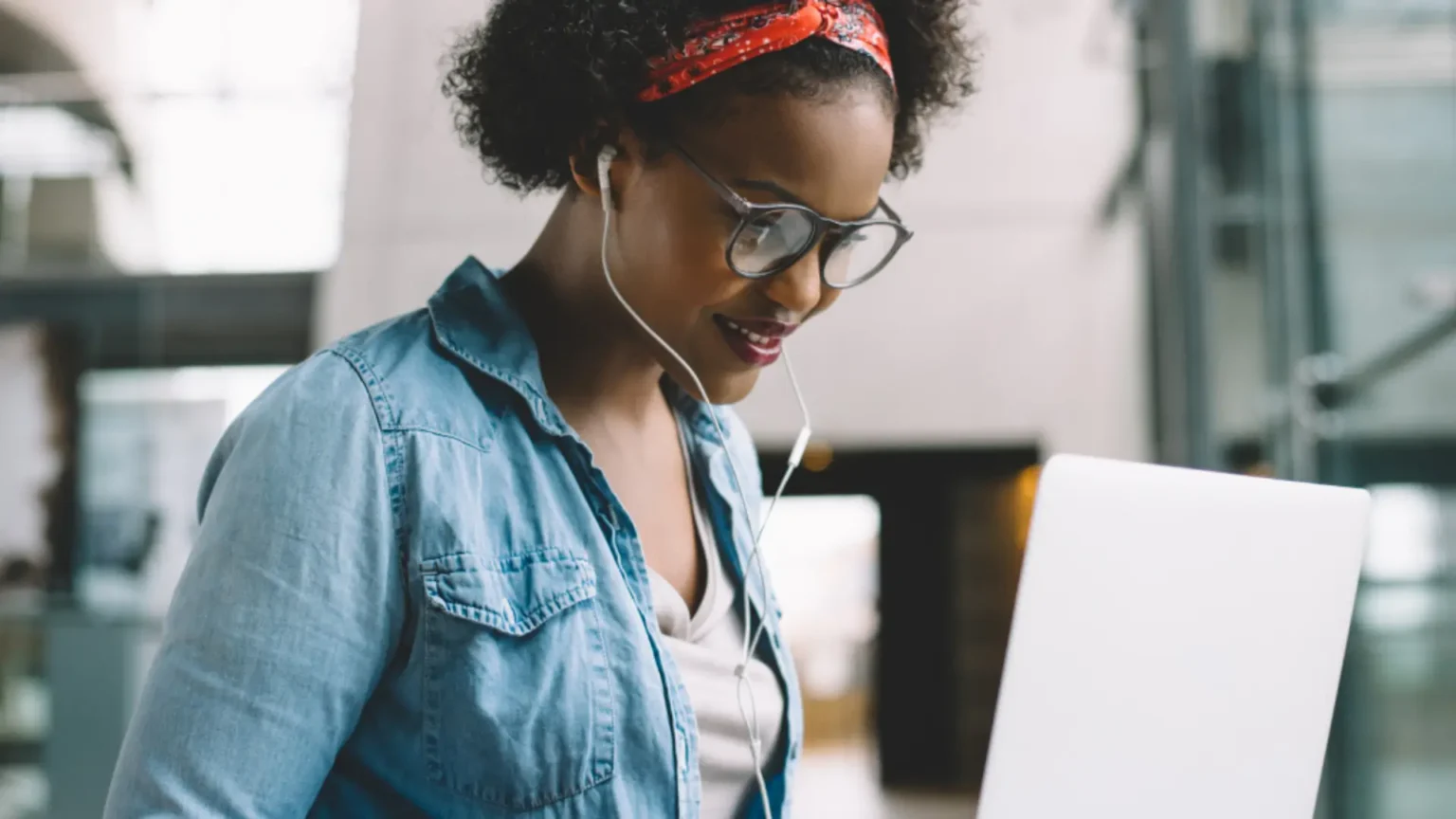 Happy female student on laptop