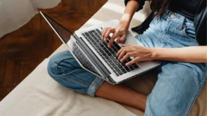young female on laptop looking at resits and retake exams