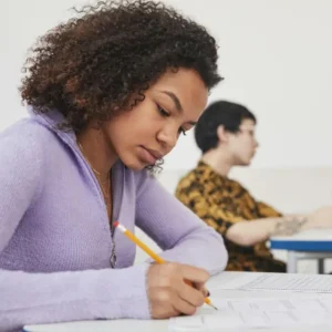 Two teenage students in an exam setting