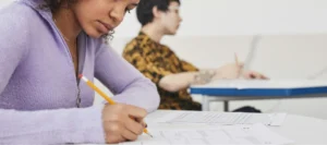 Two teenage students in an exam setting