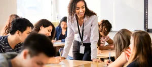 Smiling teacher talking to her students