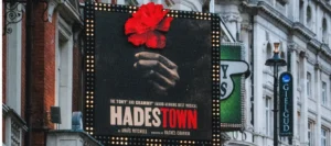 The Hadestown banner outside the theatre hosting the musical in London